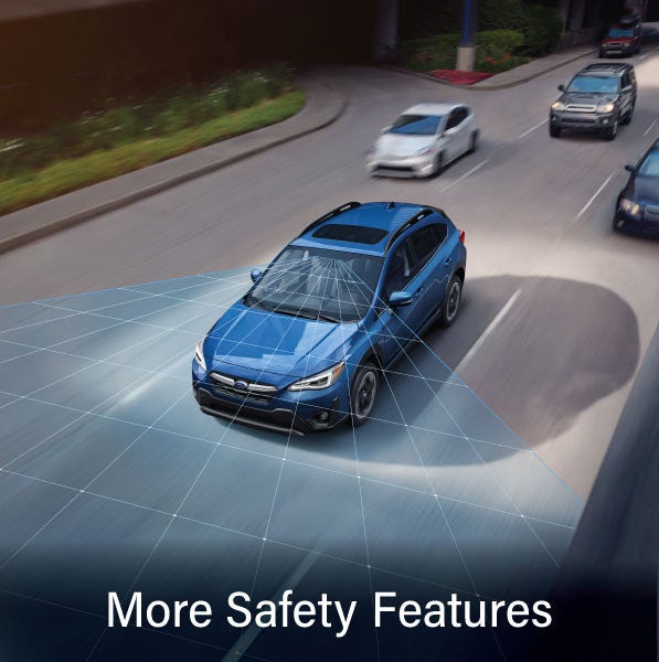 A Subaru Crosstrek in blue with the words “More Safety Features“. | SubaruDemo2 in Hillsboro OR